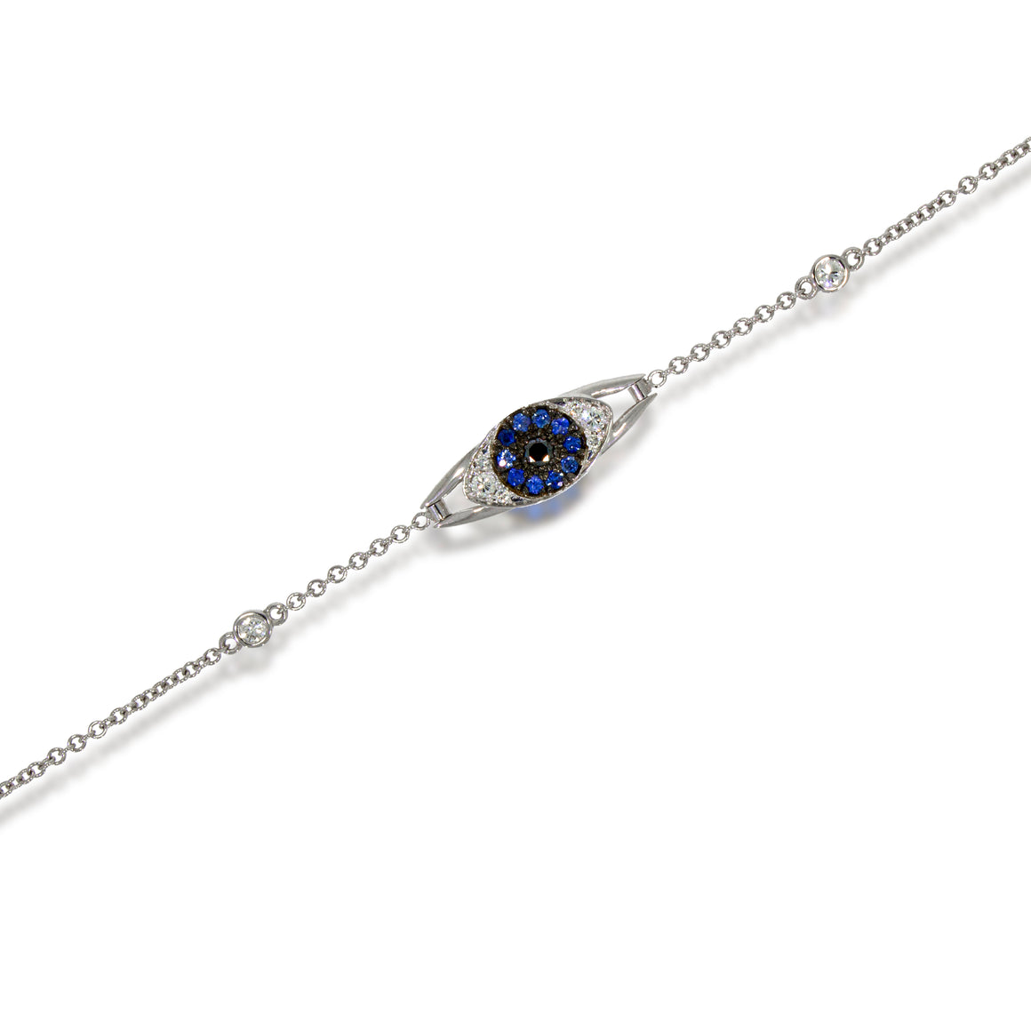 Evil Eye Bracelet 18k white gold set with blue sapphire and diamonds complemented by black diamond. blending of symbolism and sophistication