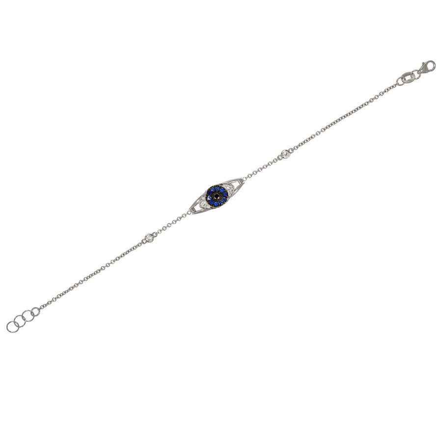 Evil Eye Bracelet 18k white gold set with blue sapphire and diamonds complemented by black diamond. blending of symbolism and sophistication