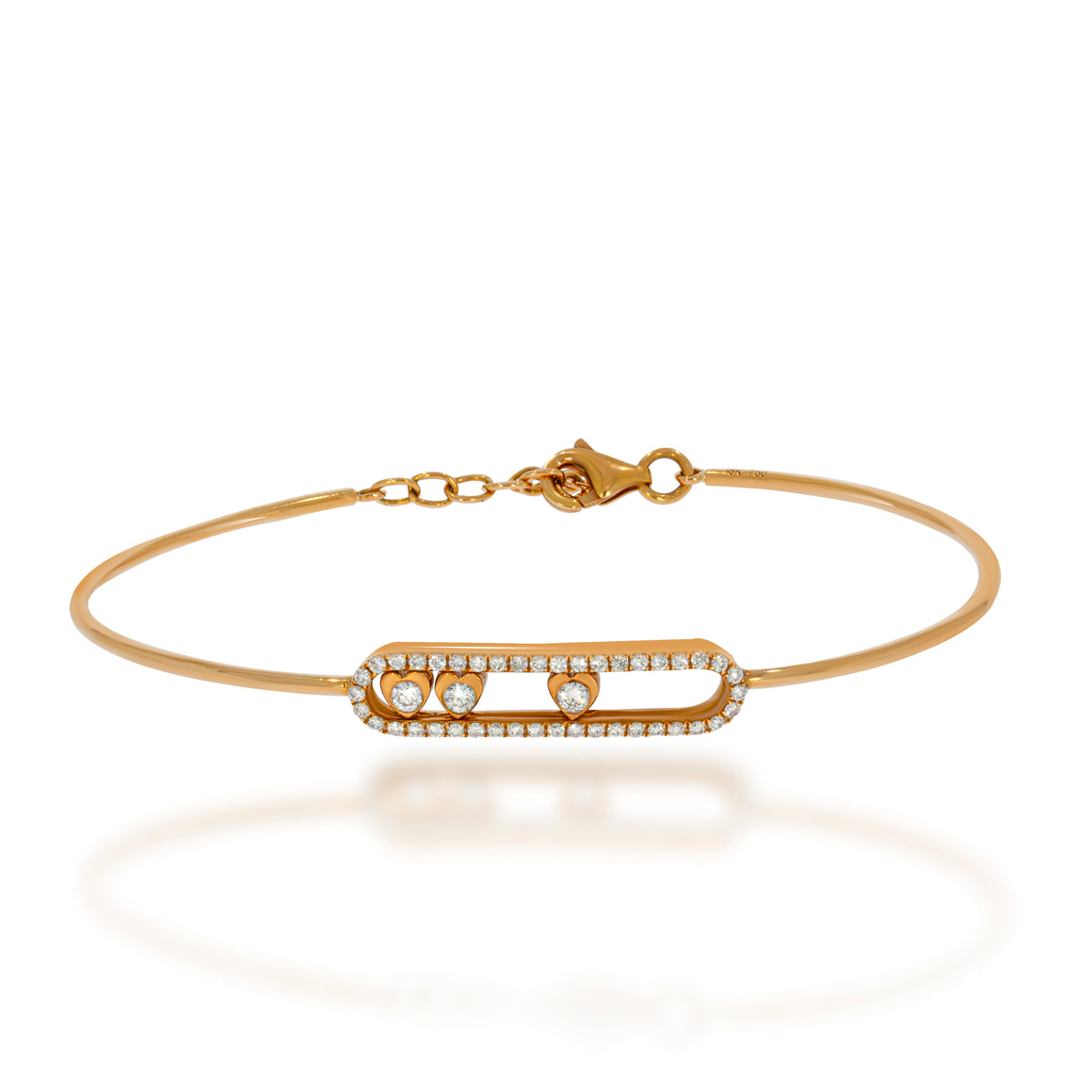 18k rose gold bangle bracelet with an open disc studded with diamonds and inside 3 hearts bazel diamonds.