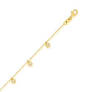 Bezel-set round diamonds in a flexible gold bracelet made of gold balls. lucky bracelet. Charm diamonds bracelet.