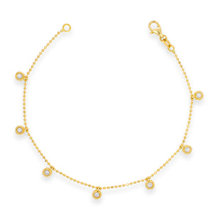 Bezel-set round diamonds in a flexible gold bracelet made of gold balls. lucky bracelet. Charm diamonds bracelet.