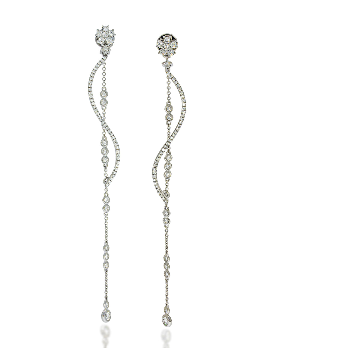 Super long diamonds earrings, 5 Station Drop Earrings, 12 Bezel Set Diamonds cups, a Ballerina sinuous diamond bar and diaomonds flower stud.