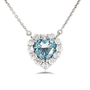 Timeless thick filigree swirl ocean blue diamond Heart shape pendant. 18k white gold set with 0.72ct glamour ocean blue diamond.