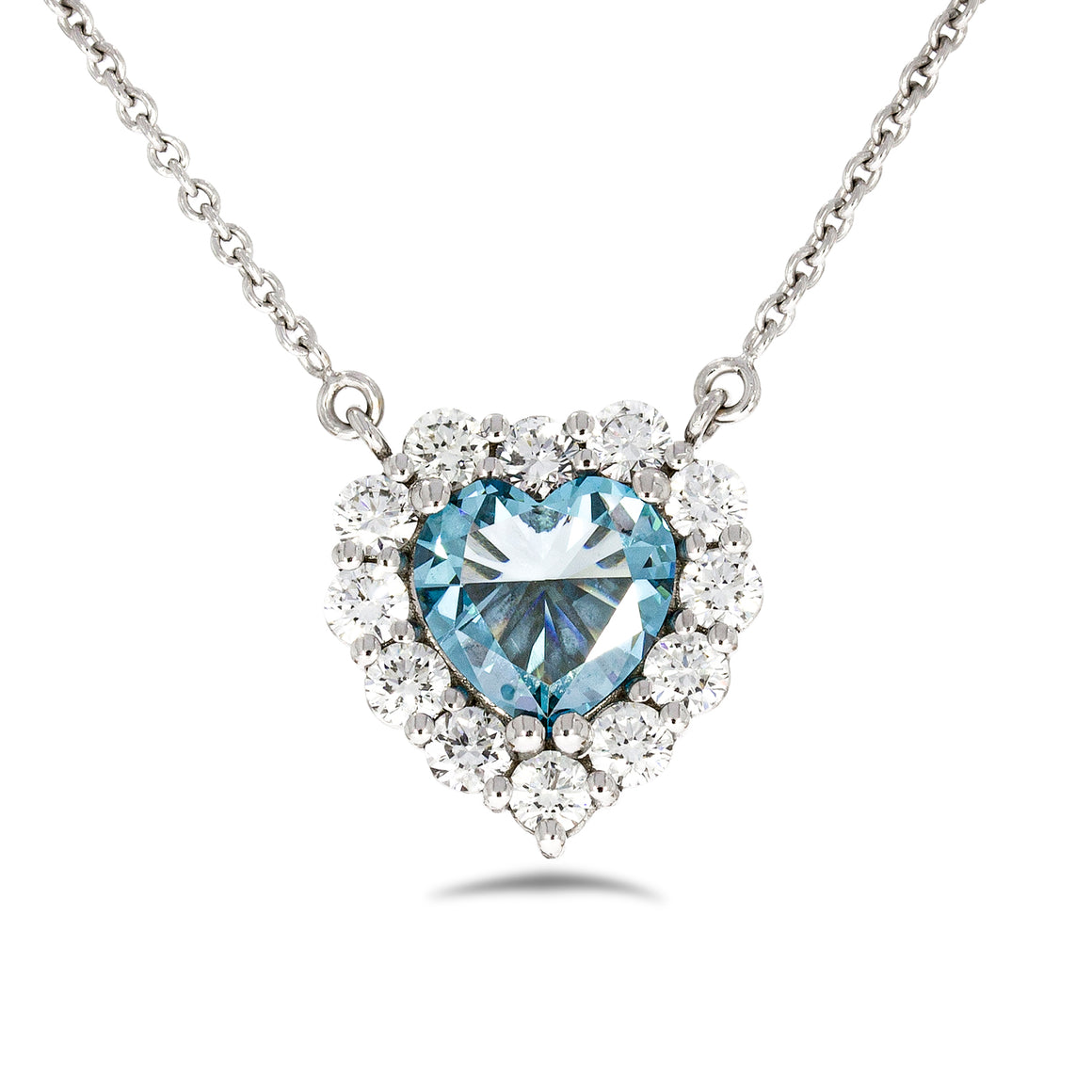 Timeless thick filigree swirl ocean blue diamond Heart shape pendant. 18k white gold set with 0.72ct glamour ocean blue diamond.