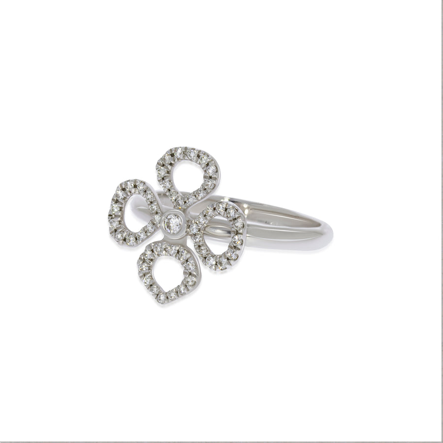 Gentle flower petals stud diamonds rings in 18K white gold set with 48 round diamonds. elegant pave stud ring. engagement / weeding rings.