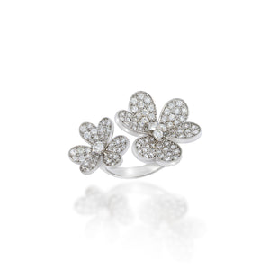 Two Luxury and Elegant flowers on 18k white gold ring. heart-shaped petals studded with diamonds, 4 big centered round diamond.