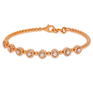 Flexible bracelet, Diamond bracelet with 18k rose gold beads interlocking. 8 round brilliant diamonds with halo diamonds around them.