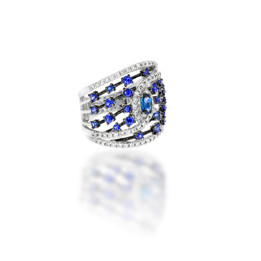 Stunning engagement ring, in a unique design, 25 blue sapphire and 68 white round natural diamonds in 18K white gold.
